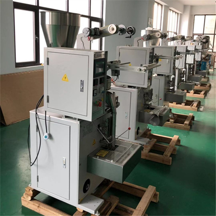 Automatic triangle bag of Tea packaging machine or Peanut or Coffee packaging machine price