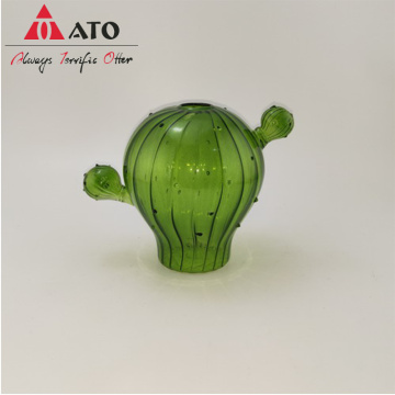 Vase en verre en forme de cactus vert avec rayures