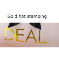 Sacchetto di carta di medie dimensioni con logo in oro rosa chiaro