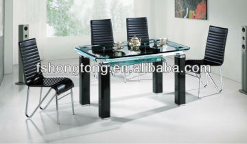Square glass dining table with black chairs