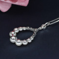 Gioielli imitazione di perle di gioielli con pendente e orecchini