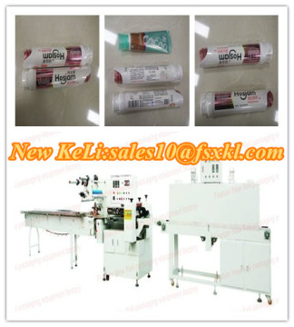 Cosmetic automatic shrink wrapping machine