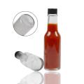 Bouteille en verre au piment à sauce piquante avec couvercle