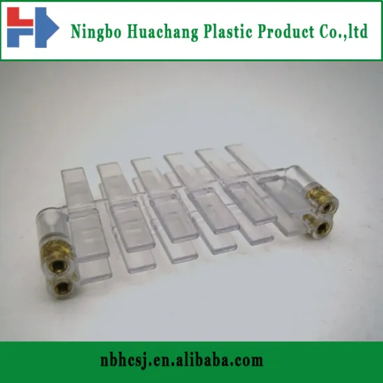 Plastic part with metal insert for gunsight