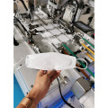 Machine automatique à grande vitesse de fabrication de masques en forme de poisson