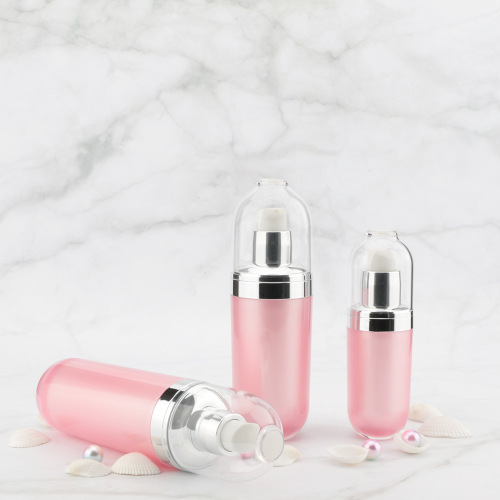 Bottiglia cosmetica rotonda in acrilico rosa con tappi ARGENTO