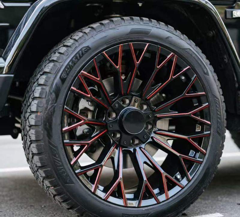 20-inch gloss black wheel with red milled edge