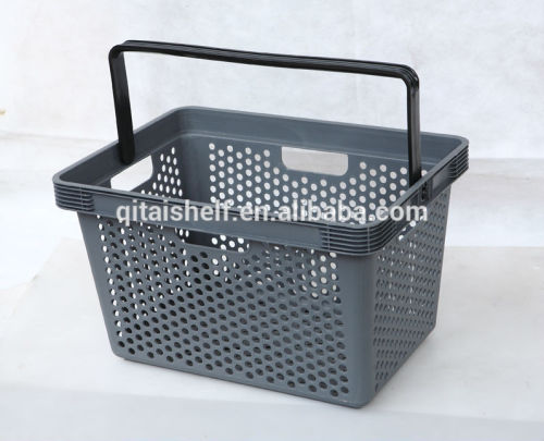 Plastic supermarket shopping basket with plastic handle