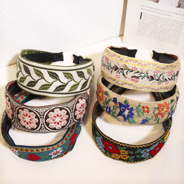 แถบคาดศีรษะ Boho พร้อมดอกไม้ชาติพันธุ์และการเย็บปักถักร้อยใบไม้: อุปกรณ์ผมที่มีสไตล์สำหรับผู้หญิง