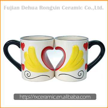 Wing to wing design heart shape decoration ceramic mug