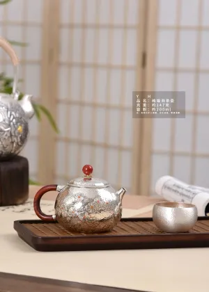 Handcrafted Silver Teapot with Delicate Daisy Hammer Design