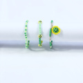 Creative hand beading with 10MM green smiley face