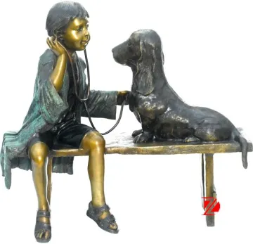 Bronze girl and dog sculpture enjoying music