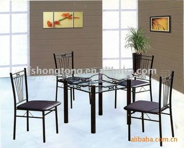 White glass dining table with black chairs