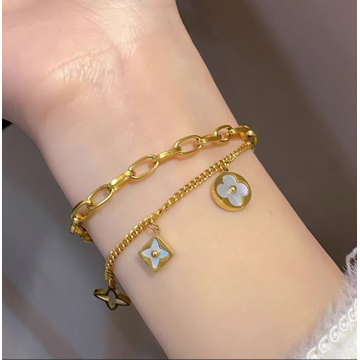 Pulsera de doble capa con trébol y cadena cubana