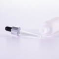 Frosted white glass oil bottle with silver dropper