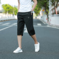 Pantalones cortos deportivos de PVC de color puro para hombre con cintura elástica