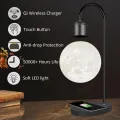 Elegante lámpara de escritorio de luz de luna con carga inalámbrica