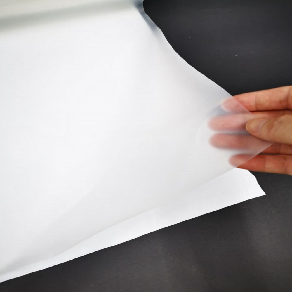 Transparent high elasticity hot melt adhesive film