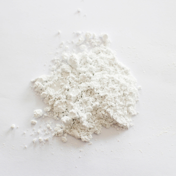 Low water content calcium carbonate carrier additive