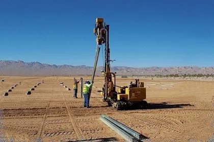 Hydraulic rammer pile driver helical piled foundations