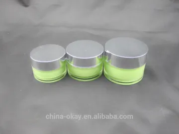 green cosmetic acrylic jar with silver cap