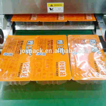 Mesin pembungkusan bacon dan ham dengan filem dan peta tegar termoforming
