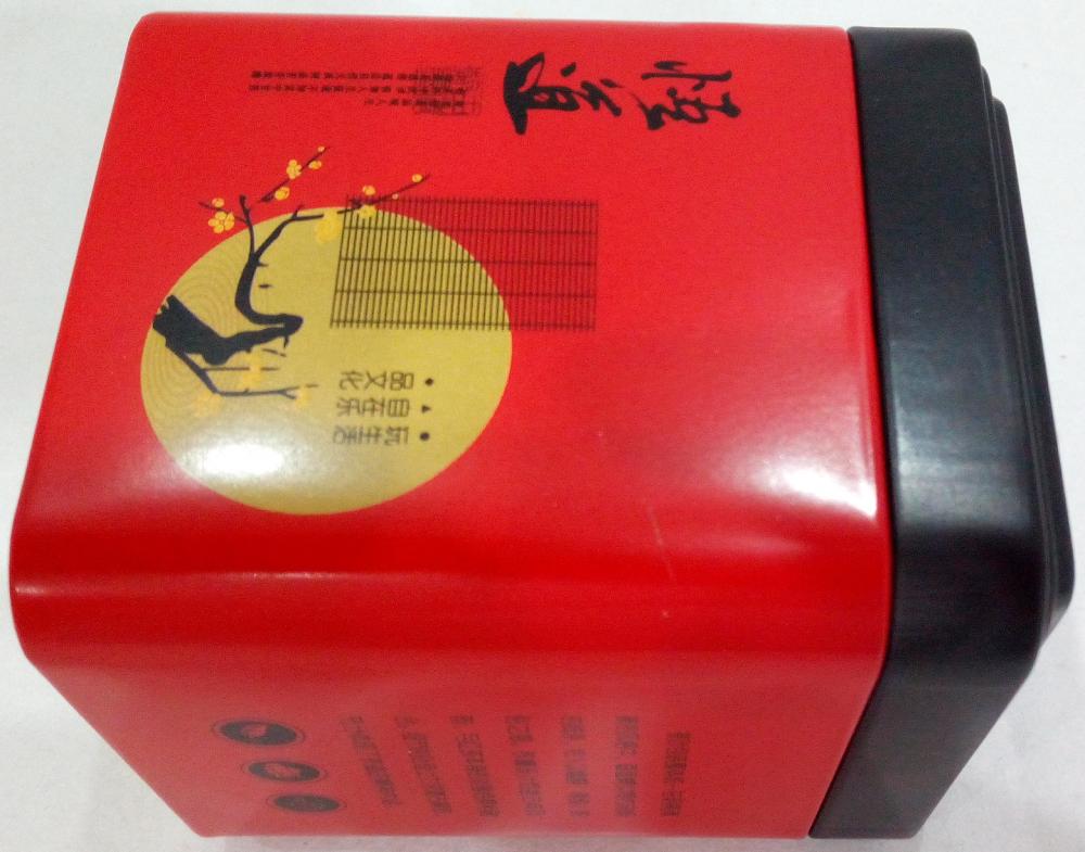 Caja de té rojo con tapa negra