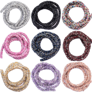 Assorted Decorative Elements: Colorful Resin Appliques, Strass Trim, Chains, Bands, Crystals, Rhinestones, and Tubes for Fashion Accessory and Garment Enhancement