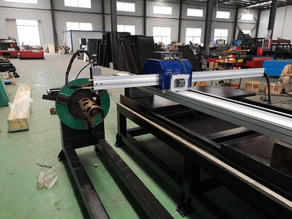 CNC plasma cutter cutting sheet with pipe cutting