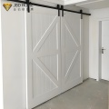 Puerta de granero corrediza de madera maciza moderna personalizada para dormitorio