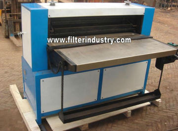 Multi-layer filter media folding machine