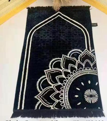 Black and white muslim prayer mat