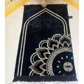 Black and white muslim prayer mat