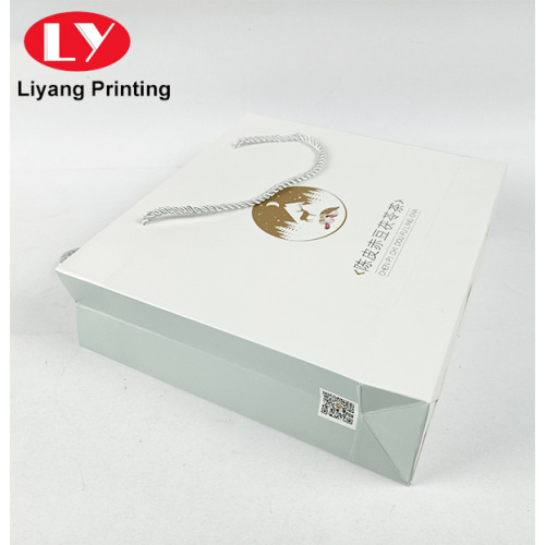 Sacchetto di carta bianco stampato personalizzato con manici