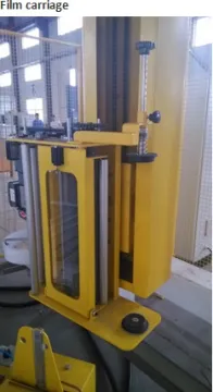 Rotary arm pre-stretch film wrapping machine