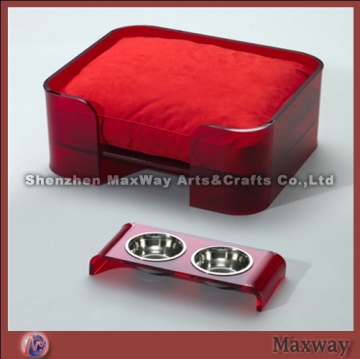 Square red lucite/acrylic pet/dog bed with red cushion and bowls