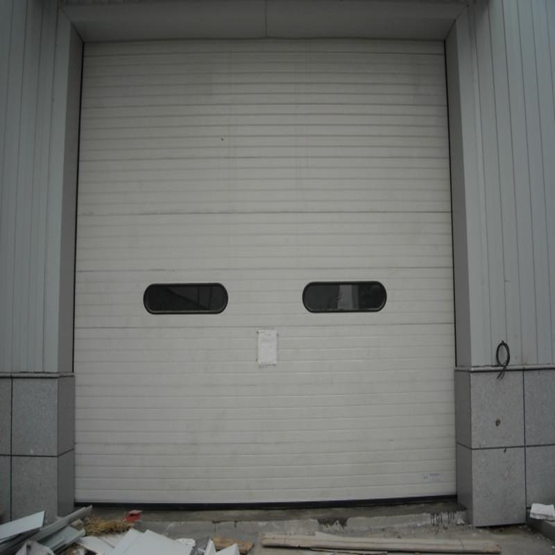 High speed vertical sectional door