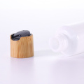Slant shoulder white bottle with bamboo dispensing lid