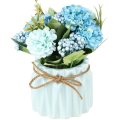 Bouquet de hortensia artificial con un pequeño jarrón de cerámica