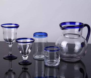 blue color edge drinking glass goblet cup and pitcher