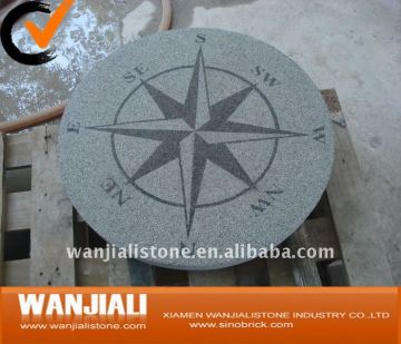 Granite stone compass outdoors