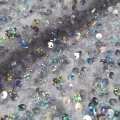 Tessuto per abiti con paillettes metalliche iridescenti olografiche