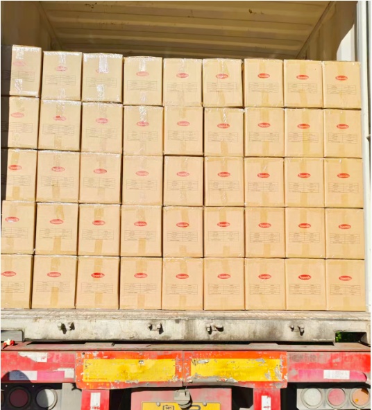 Loading umbrellas into shipping container