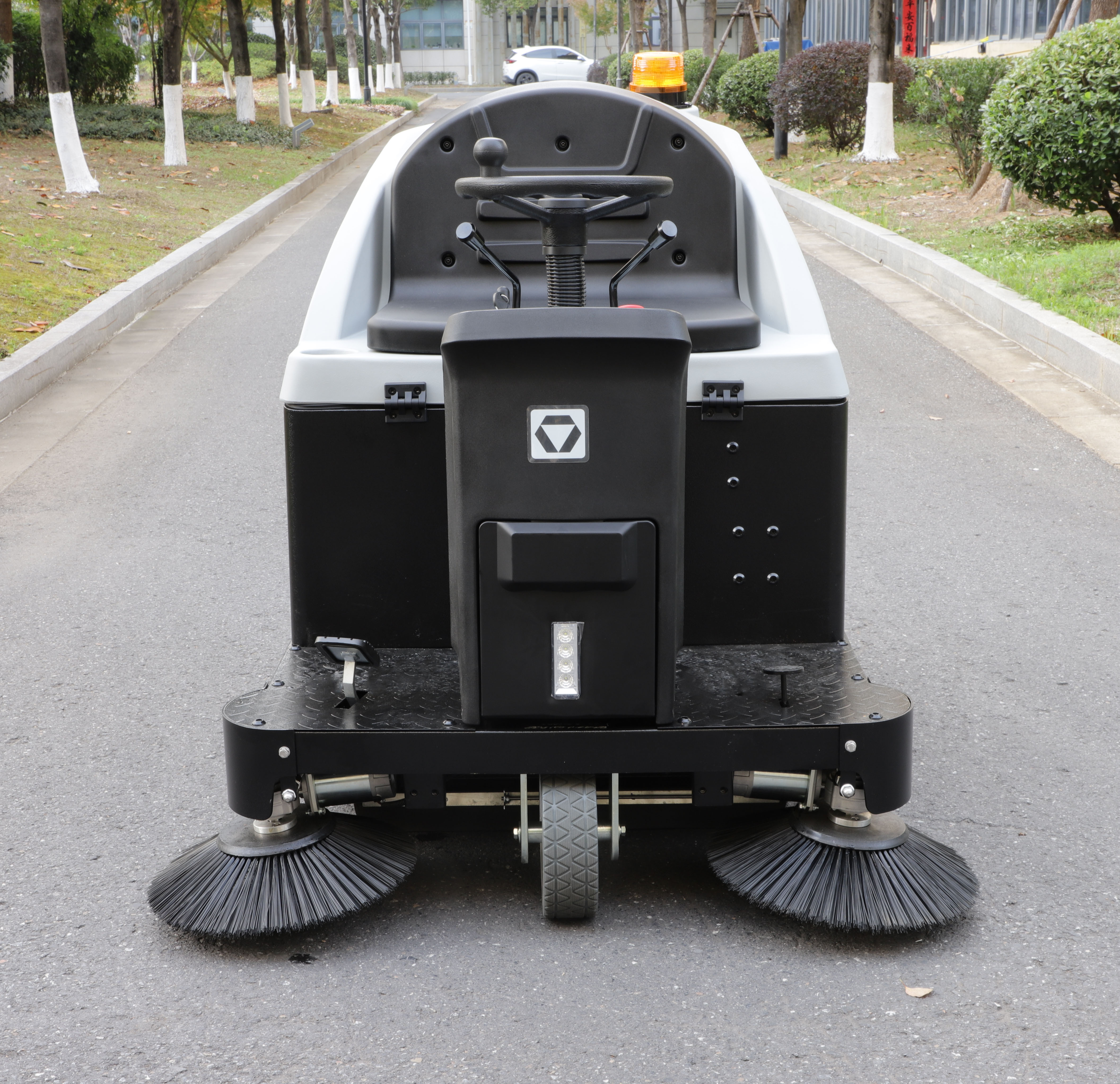 Ride-on floor sweeper