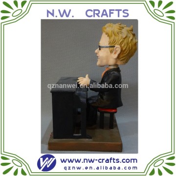 Elton John bobble head figurines