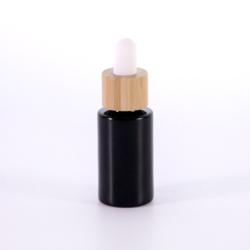 Black flat shoulder glass essential oil bottle