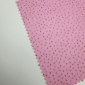 Tessuto jersey lavorato a maglia con pois glitter dorati
