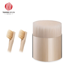 Biodegradable filament for wooden toothbrush