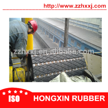 Elevator driving pulley slide lagging pads